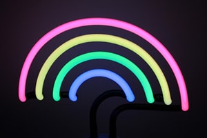 Desktop multi-coloured neon rainbow novelty lamp.
