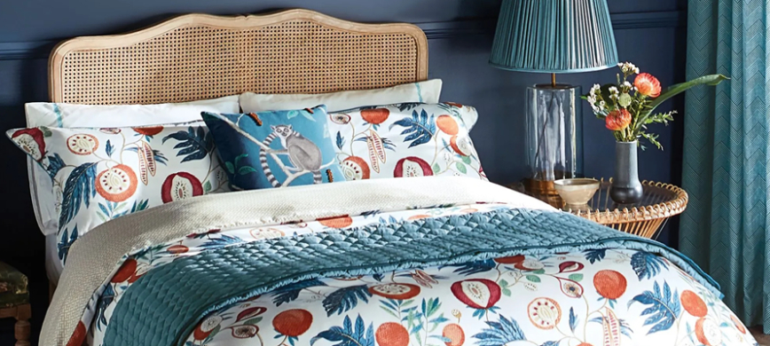 Sanderson Jackfruit Bedding - A colourful, stylised jackfruit and leaf design against a white background.