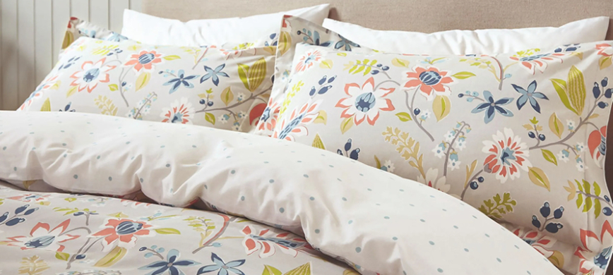 Sanderson Myrtle Bedding - A stylised hand-drawn floral pattern uses marine-inspired shades of coral, blue and green.
