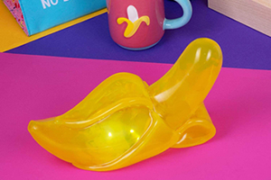A novelty yellow, semi-transparent peeled banana shaped light.